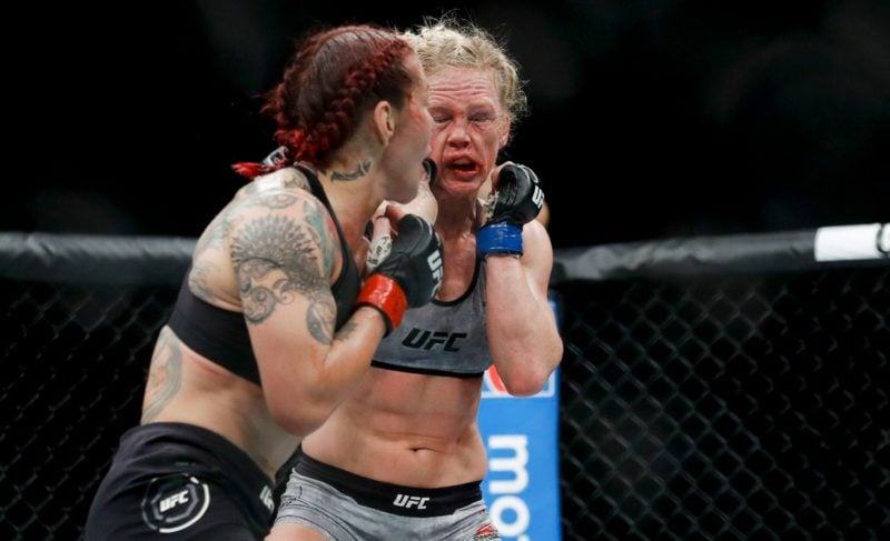 Cris Cyborg connects with a punch vs. Holly Holm at UFC 219