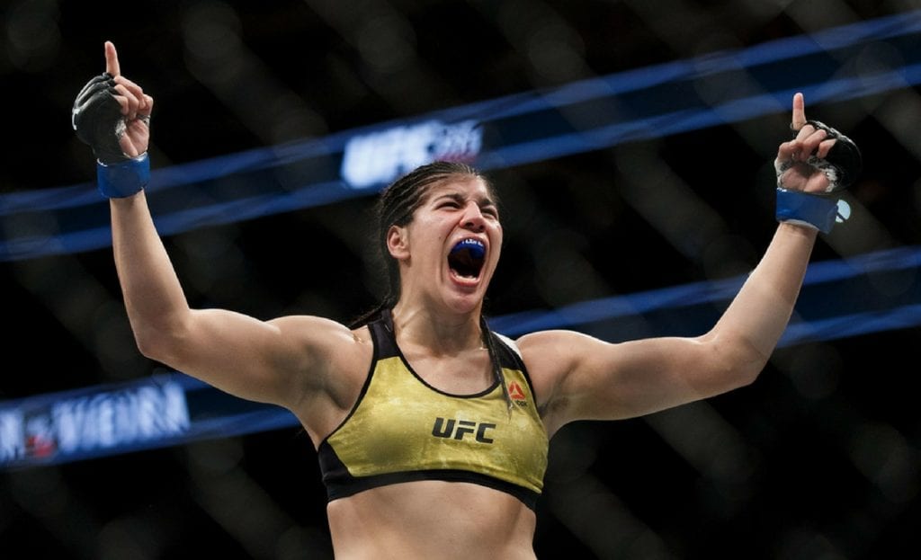 Ketlen Vieira celebrates her victory against Sara McMann