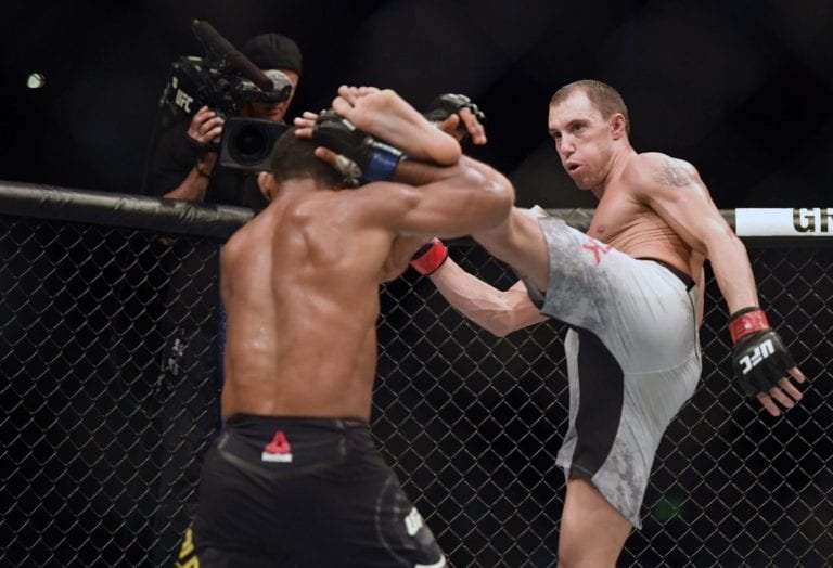 James Vick attempts a left high kick against Francisco Trinaldo