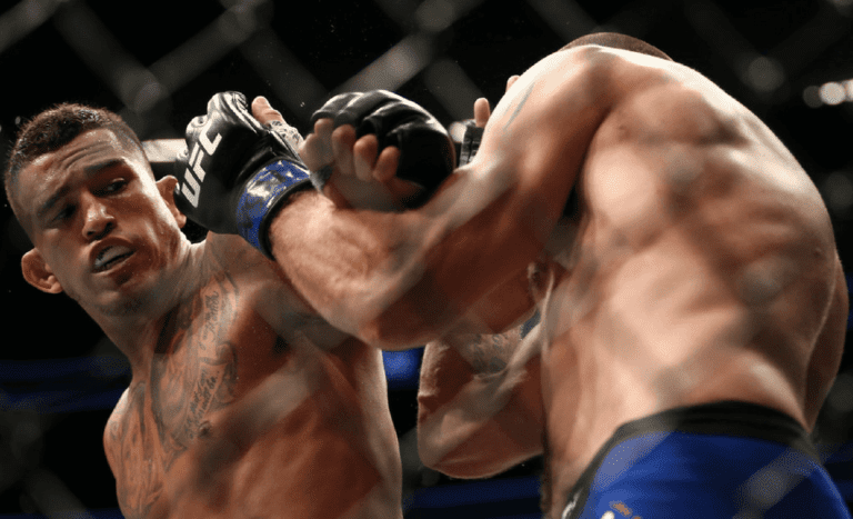 Anthony Pettis punches Jim Miller in their lightweight bout