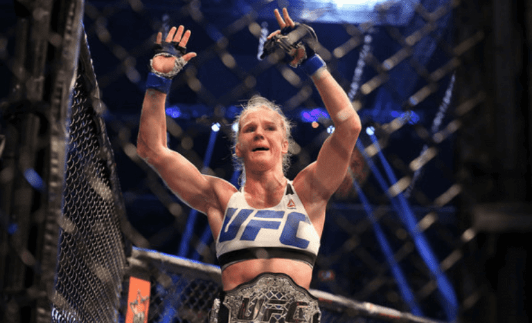 Holly Holm of the United States celebrates victory over Ronda Rousey