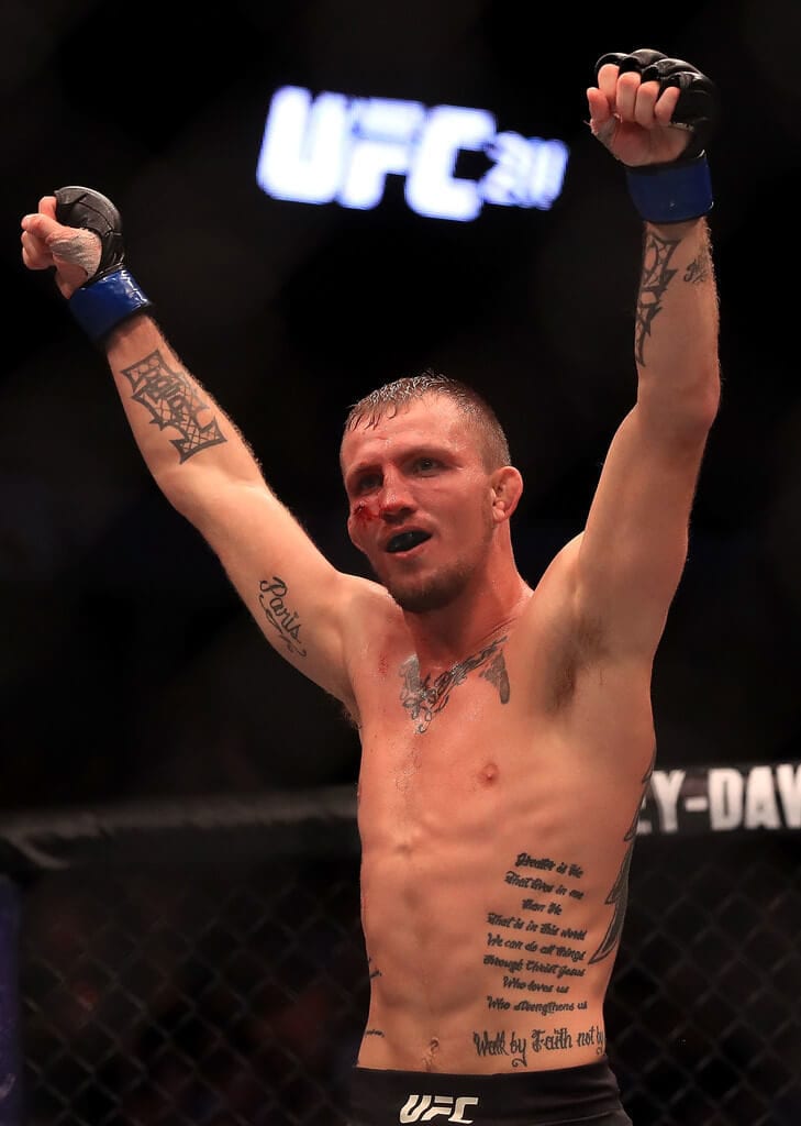 Jason Knight celebrates his victory against Chas Skelly at UFC 211