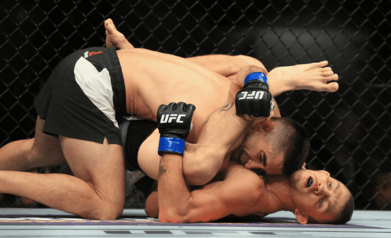 Jason Knight attempts to attack Ricardo Lamas from rubber guard at UFC 214