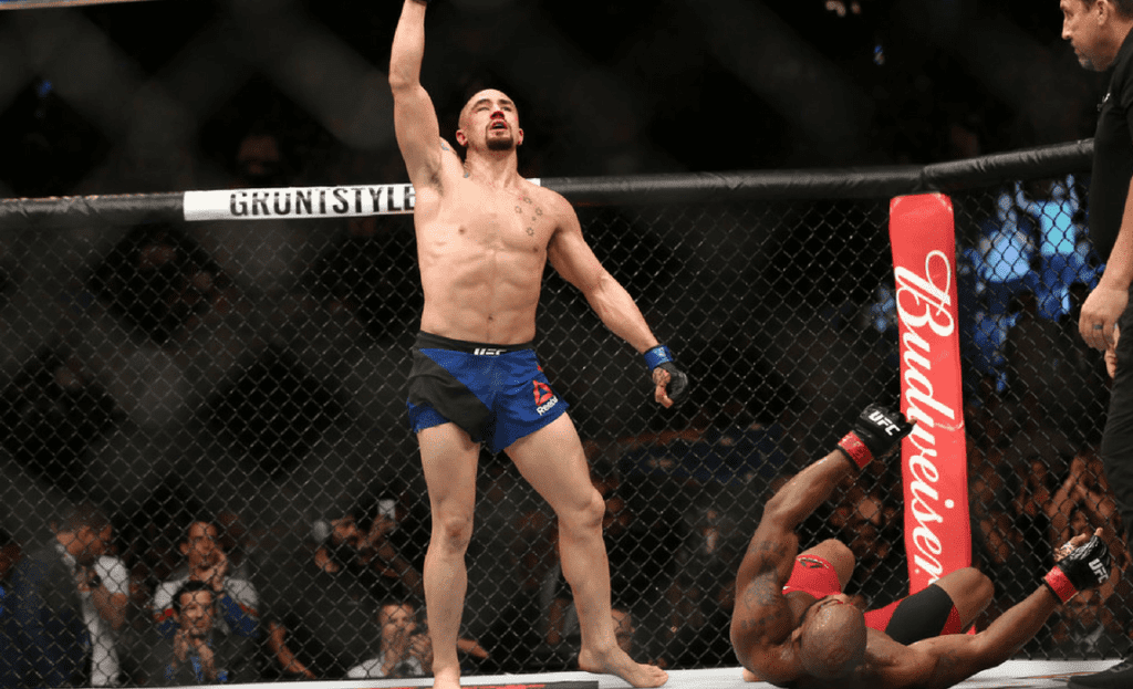 Robert Whittaker celebrates after his bout against Yoel Romero in their interim UFC middleweight championship bout during the UFC 213 event at T-Mobile Arena