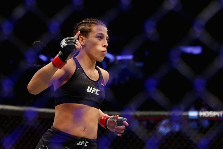 Joanna Jedrzejczyk of Poland enters the ring for her UFC women's strawweight championship bout against Rose Namajunas during the UFC 217 event at Madison Square Garden