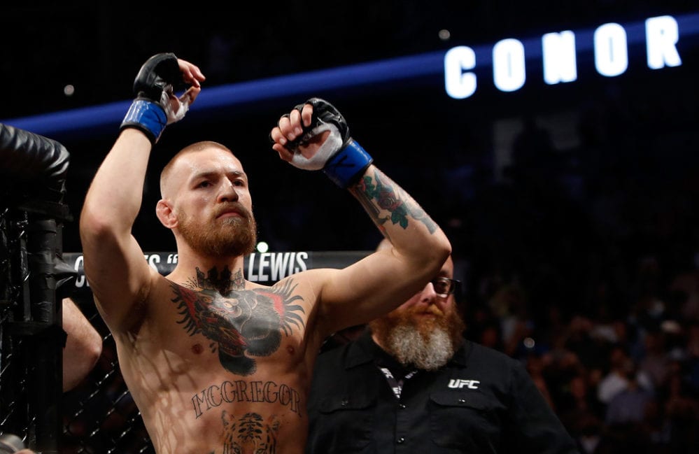 Conor McGregor gestures as he arrives for his welterweight rematch against Nate Diaz at the UFC 202 event at T-Mobile Arena