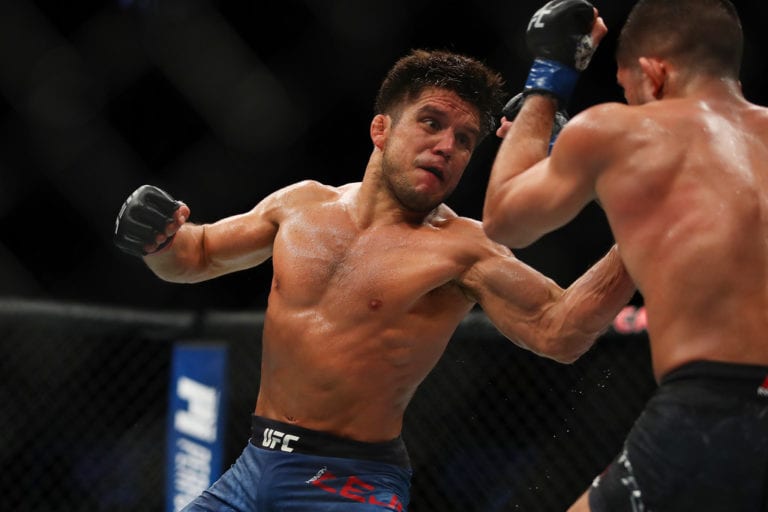 Henry Cejudo (L) battles Sergio Pettis (R) during UFC 218