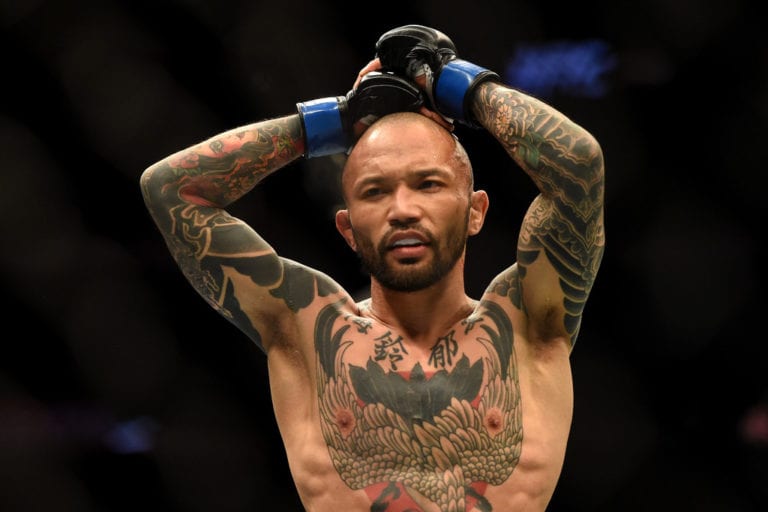 Norifumi "Kid" Yamamoto of Japan walks to his corner during UFC 184