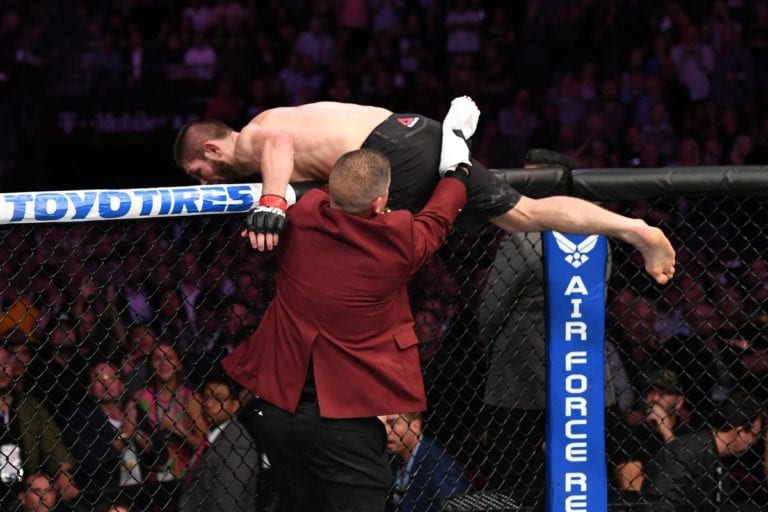 Khabib Nurmagomedov jumps the cage to attack Dillon Danis