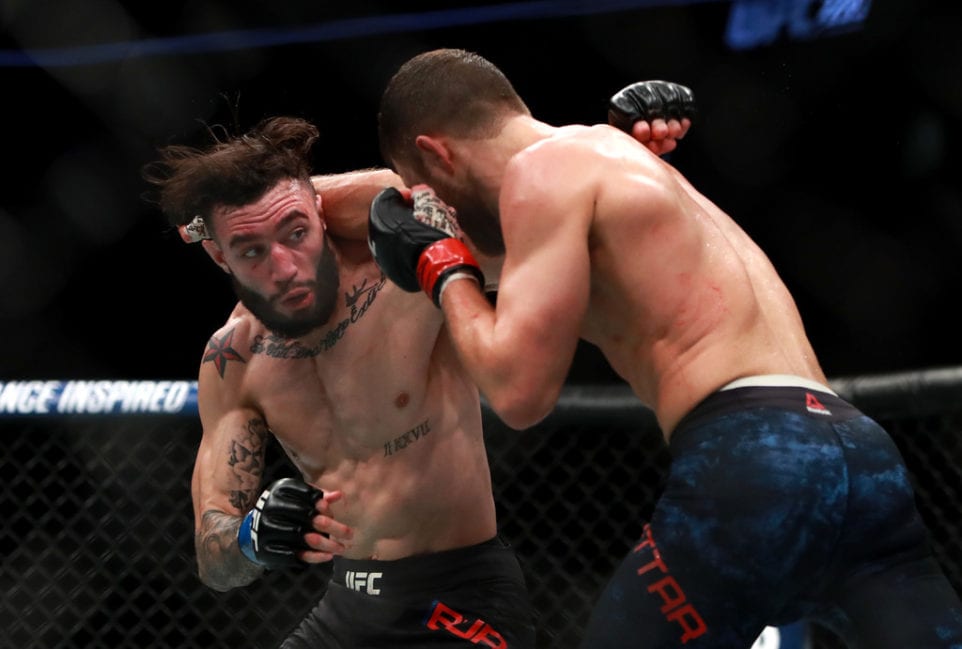 Calvin Kattar throws a punch against Shane Burgos at UFC 220