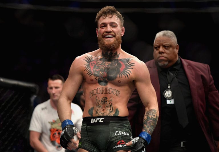 Conor McGregor of Ireland laughs after the first round against Khabib Nurmagomedov