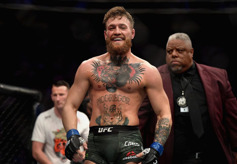 Conor McGregor of Ireland laughs after the first round against Khabib Nurmagomedov