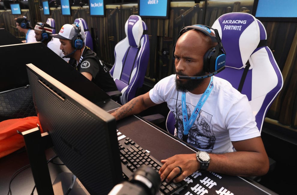 Demetrious Johnson gaming at the Epic Games Fortnite E3 event