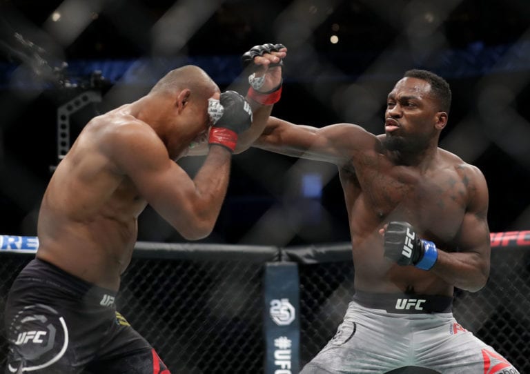 Derek Brunson punches Ronaldo "Jacare" Souza of Brazil in their middleweight bout during UFC Fight Night