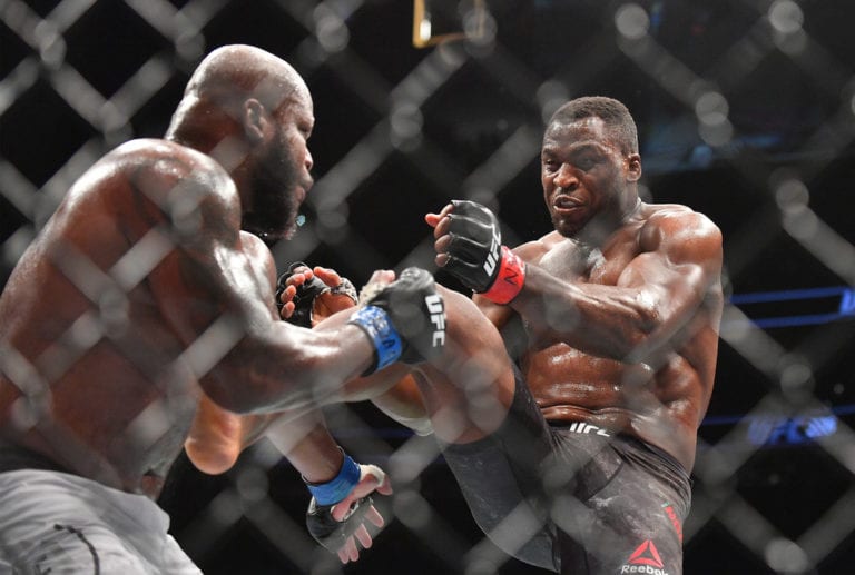 Francis Ngannou kicks Derrick Lewis during their UFC heavyweight fight