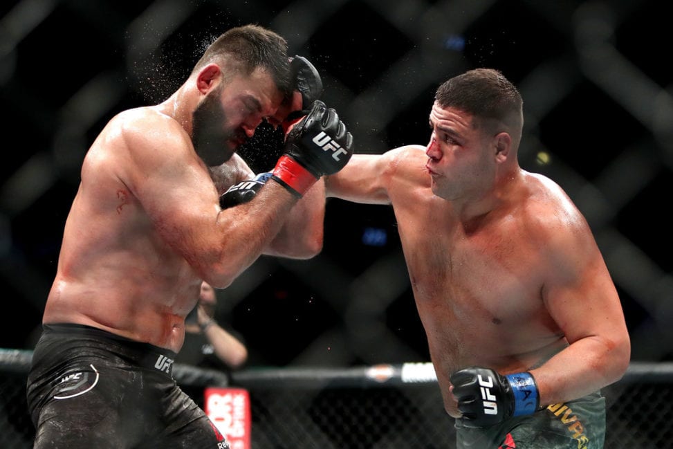 Tai Tuivasa lands a right hand punch on Andrei Arlovski during their heavyweight fight at UFC 225