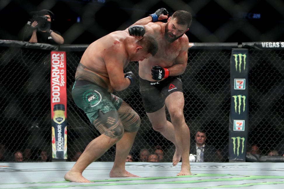 Andrei Arlovski of Belarus (R) attempts a punch against Tai Tuivasa of Australia in the second round in their heavyweight bout during the UFC 225