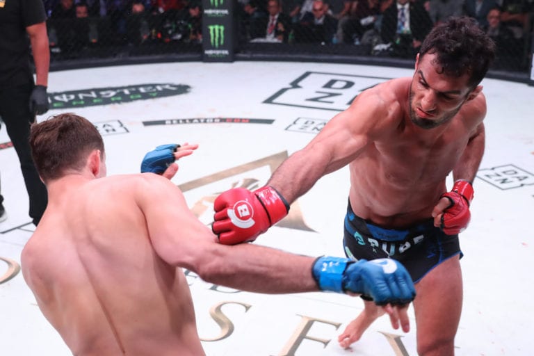 Gegard Mousasi sends a right hand Rory Macdonald's way