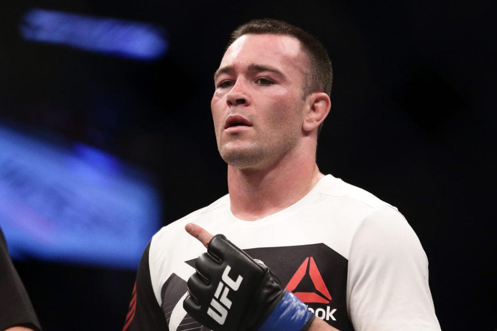 Colby Covington of United States (front) gestures after defeating Dong Hyun Kim of South Korea