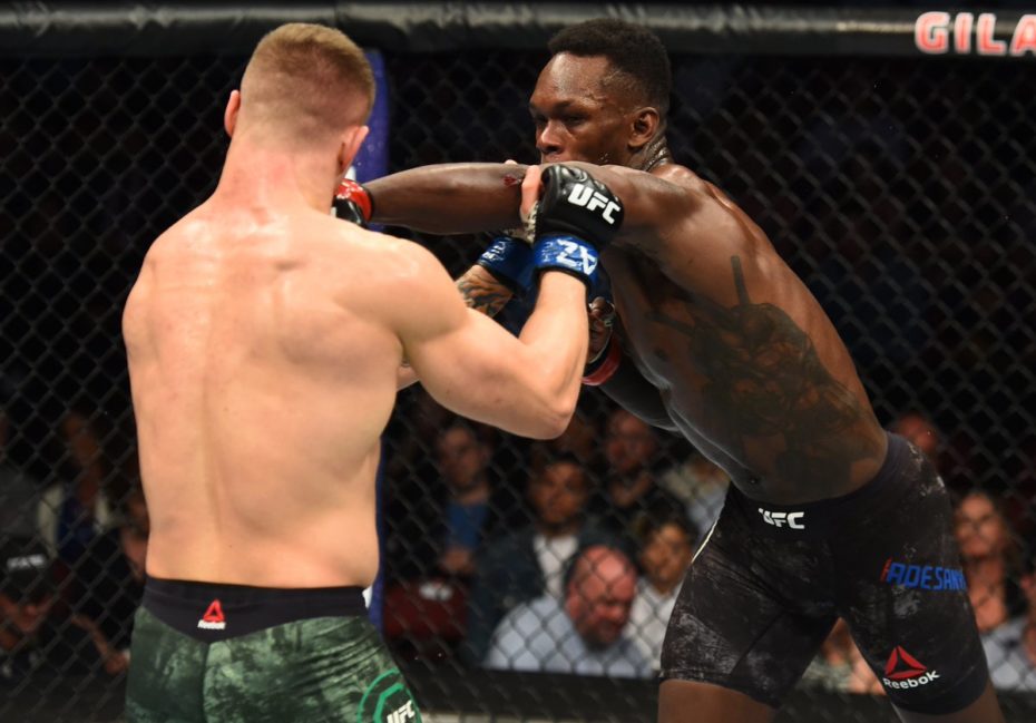 Israel Adesanya lands a left punch on Marvin Vettori