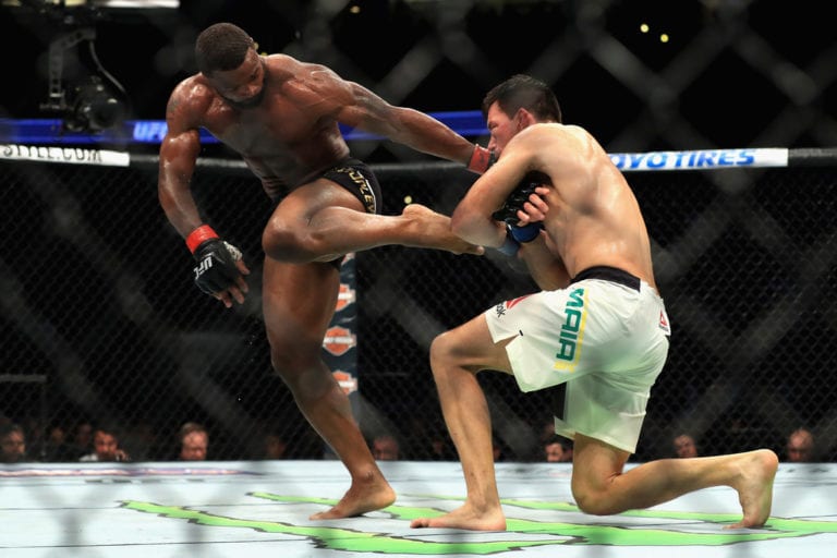 Tyron Woodley (black shorts) fights Demian Maia of Brazil in the Welterweight title bout during UFC 214