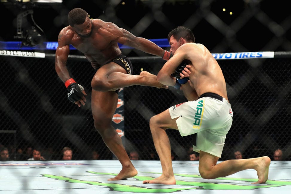Tyron Woodley (black shorts) fights Demian Maia of Brazil in the Welterweight title bout during UFC 214