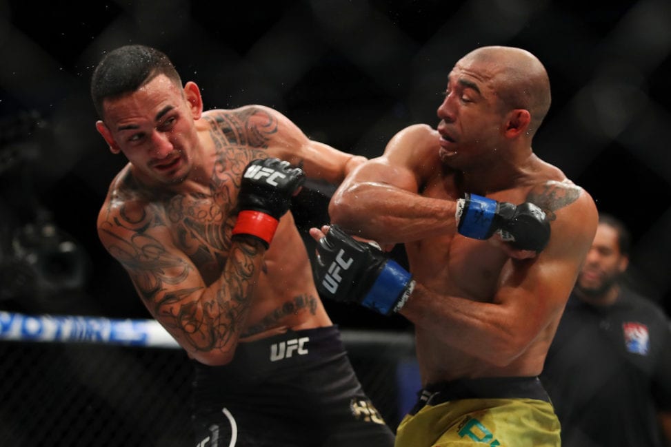 Max Holloway (L) battles Jose Aldo of Brazil (R) during UFC 218 at Little Caesars Arena on December 2, 2018 in Detroit, Michigan.