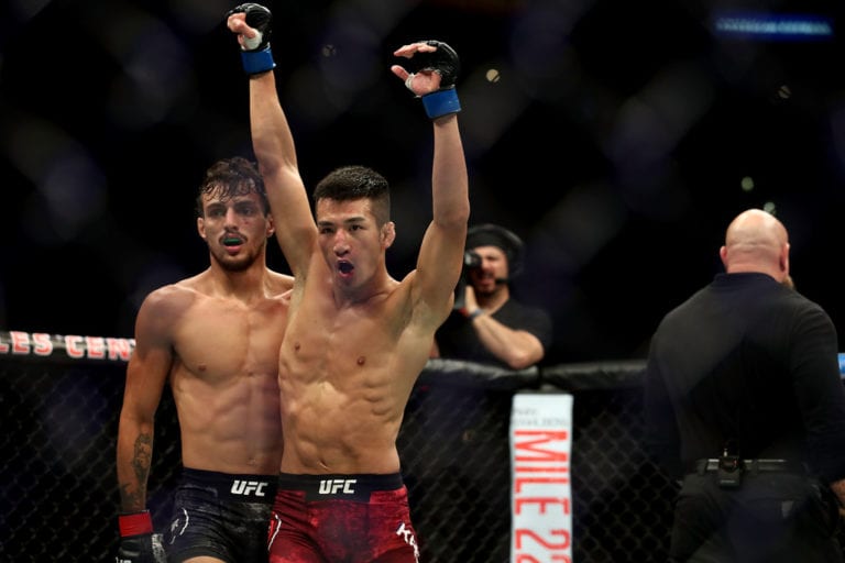 Ricardo Ramos and Kyung Ho Kang embrace after their bantamweight bout during UFC 227 at Staples Center on August 4, 2018 in Los Angeles, United States