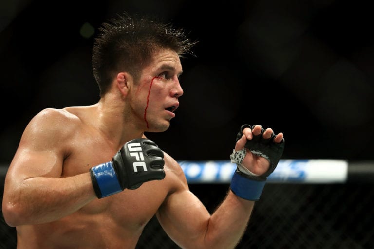 Henry Cejudo bleeds from the head in the third round against Demetrious Johnson in the UFC Flyweight Title Bout during UFC 227