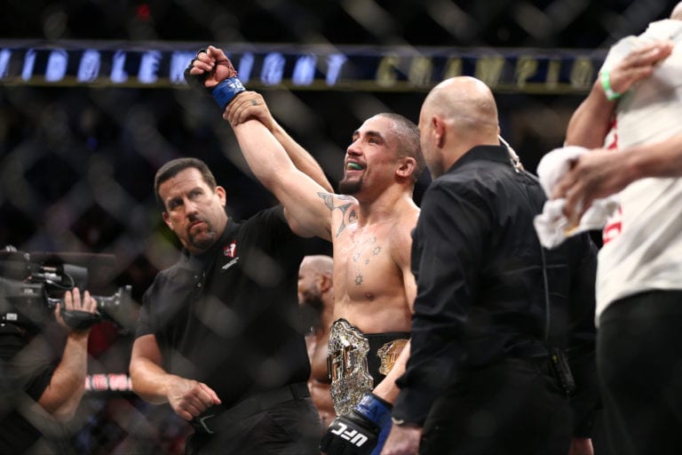 Robert Whittaker celebrates after his victory over Yoel Romero