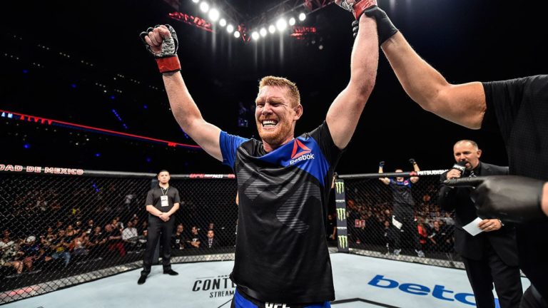 Sam Alvey celebrates a UFC win