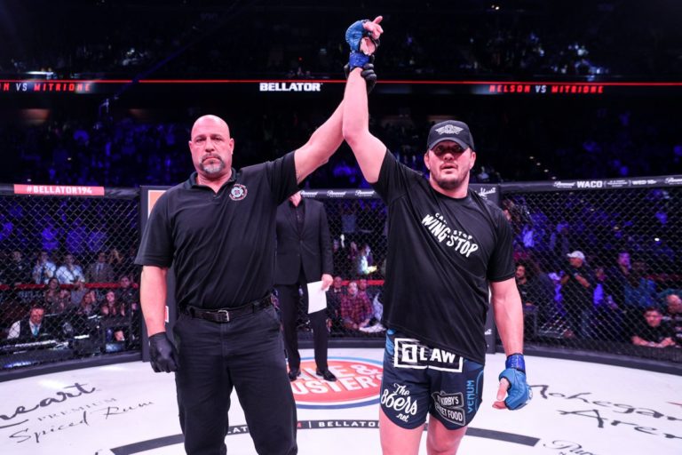 Matt Mitrione has his hand raised after a Bellator MMA win