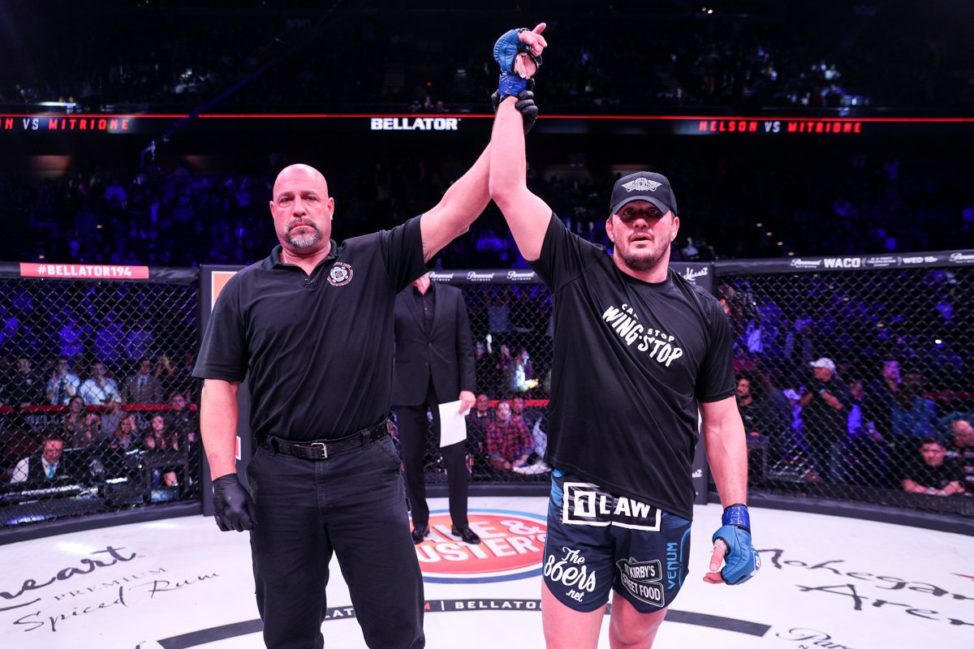 Matt Mitrione has his hand raised after a Bellator MMA win