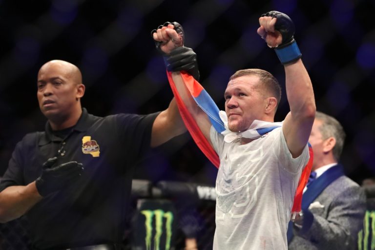 Petr Yan celebrates a UFC victory