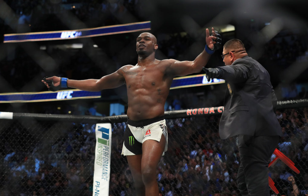 Jon Jones celebrates after knocking out Daniel Cormier in their UFC light heavyweight championship bout during the UFC 214