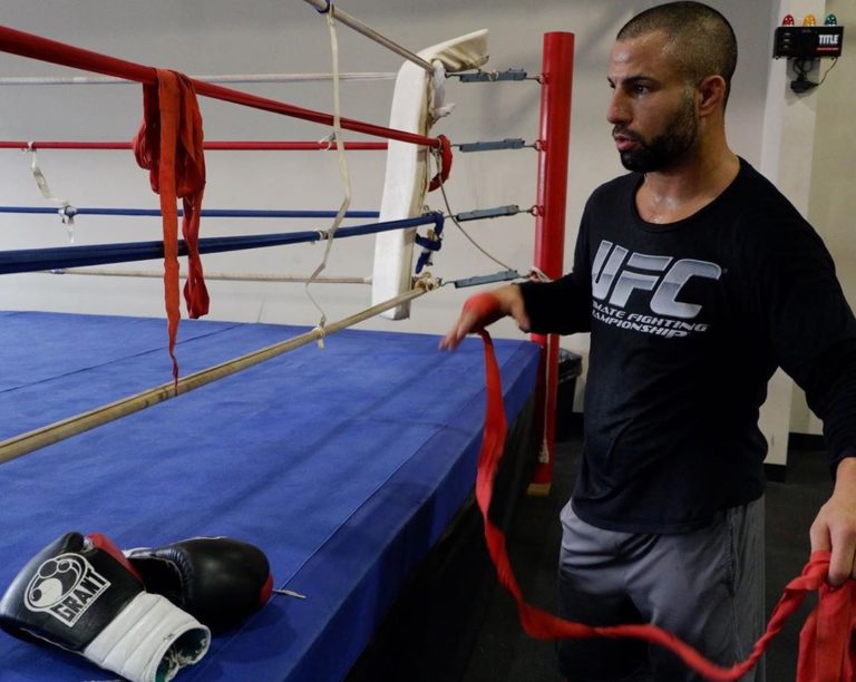 John Makdessi wraps his hand before training for a UFC fight