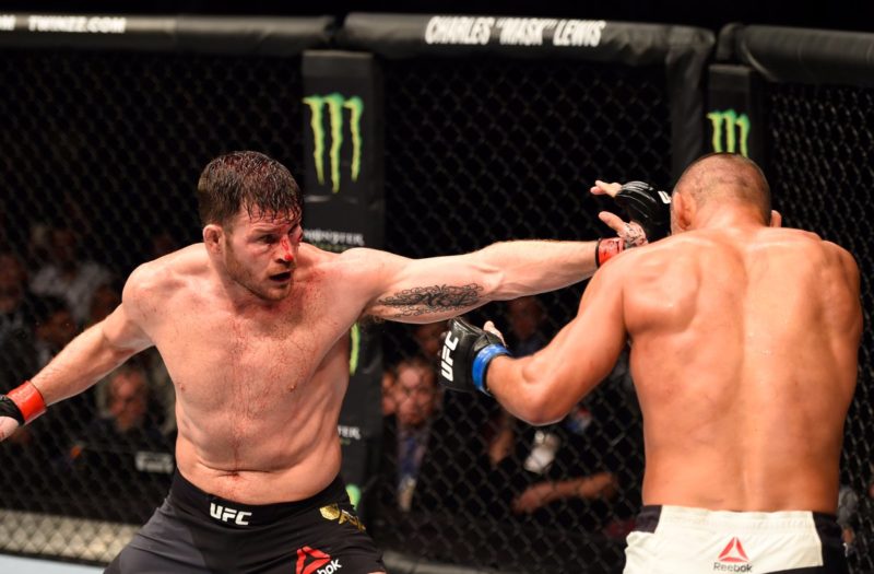 Michael Bisping throws out a jab toward Dan Henderson in a UFC Middleweight Championship bout