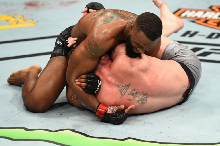 Tyron Woodley squeezes Darren Till with a D'Arce choke to defend his UFC Welterweight Championship
