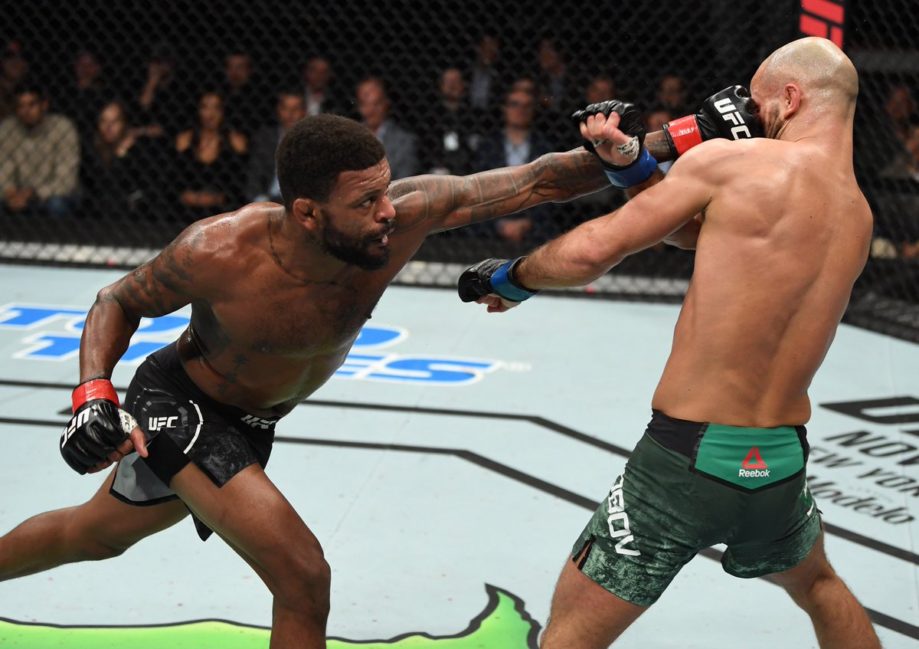 Michael Johnson lands a left punch against Artem Lobov in the UFC