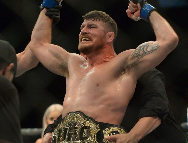 Michael Bisping reacts after defeating Luke Rockhold in their Middleweight Title Bout at UFC 199