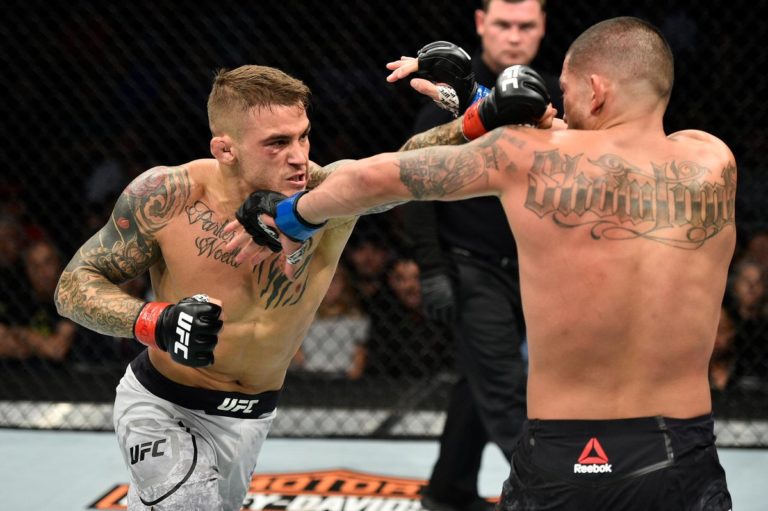 Dustin Poirier strikes Anthony Pettis with a left punch in the UFC
