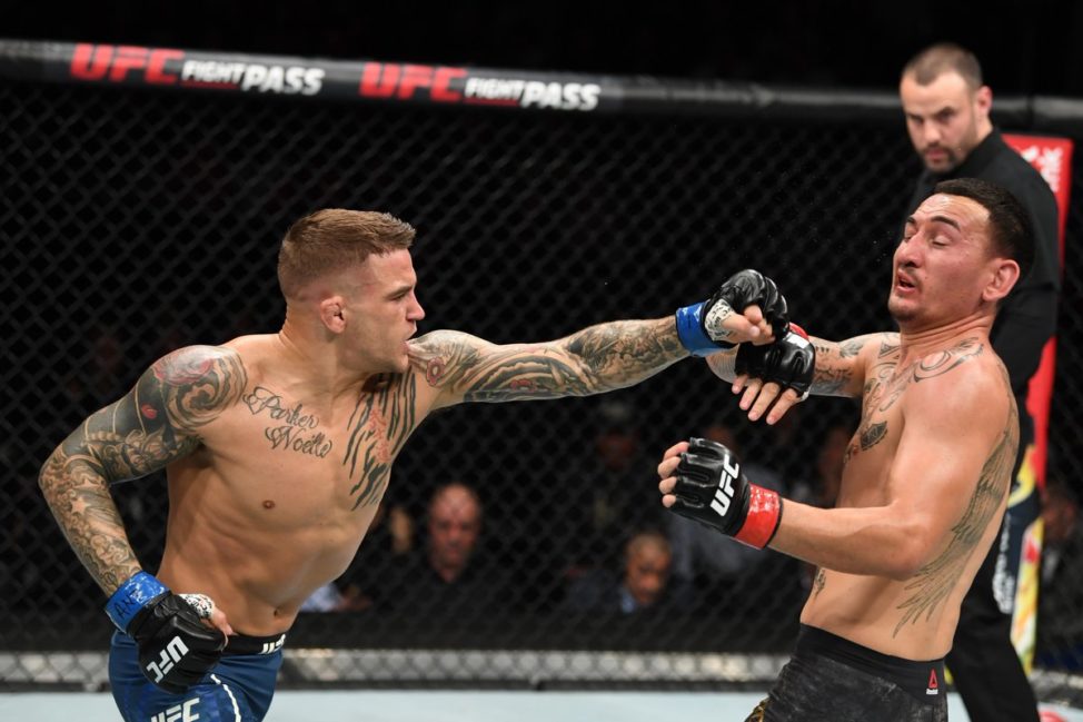 Dustin Poirier strikes Max Holloway at UFC 236