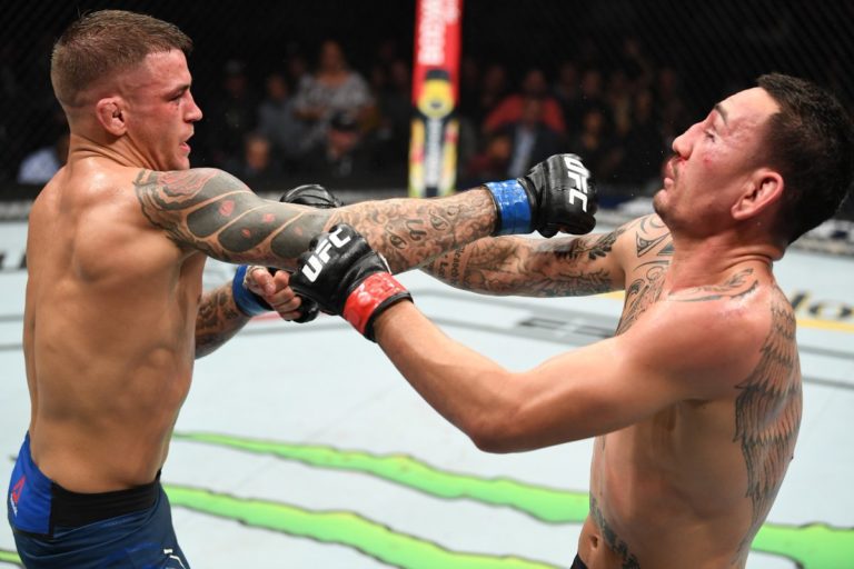 Dustin Poirier punches Max Holloway at UFC 236