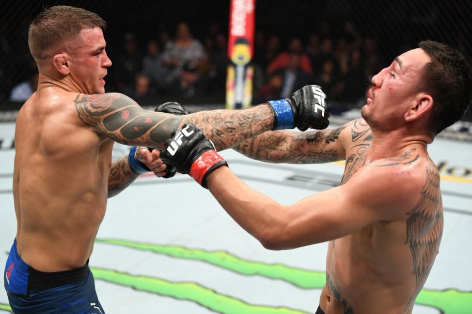 Dustin Poirier punches Max Holloway at UFC 236