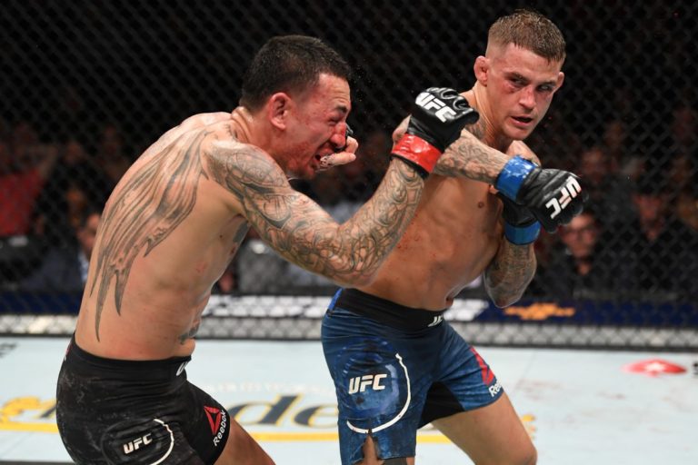 Dustin Poirier strikes Max Holloway during UFC 236