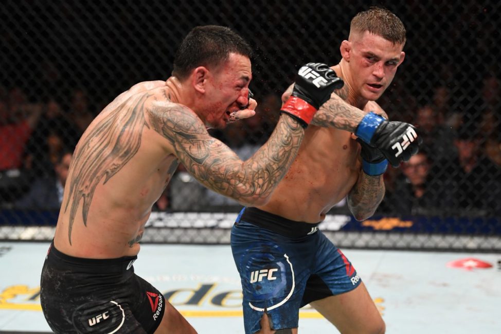 Dustin Poirier strikes Max Holloway during UFC 236