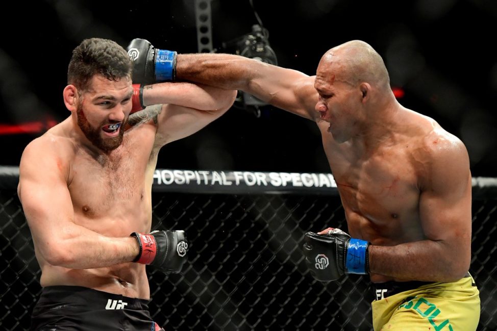 Ronaldo "Jacare" Souza attempts to strike Chris Weidman at UFC 230