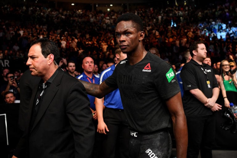 Israel Adesanya of Nigeria walks from the Octagon after winning his Middleweight bout against Anderson Silva of Brazil during UFC234