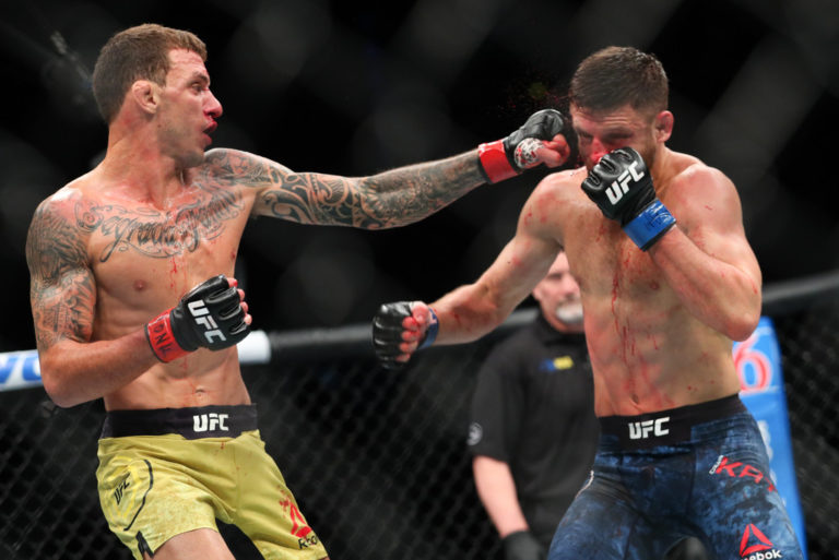 Renato Moicano(L) lands a left hand to the head of Calvin Kattar (R) during their featherweight bout at UFC 223