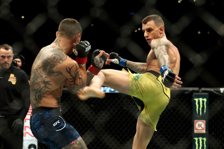 Renato Moicano kicks Cub Swanson in the first round of their featherweight bout during UFC 227
